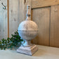 Rounded stone finial